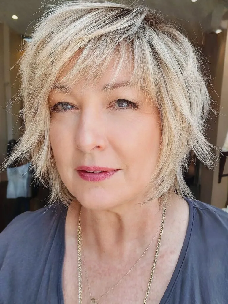 Layered bob with bangs for round faces