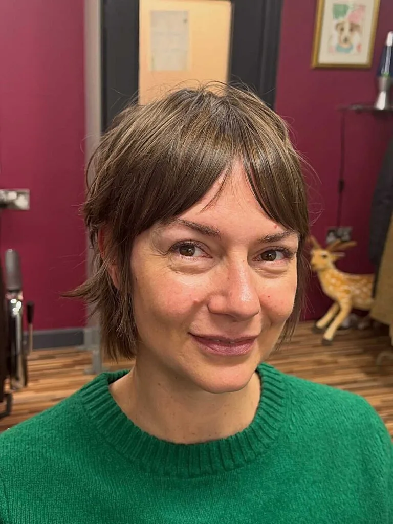 Light brown wispy bixie with sheer bangs and ear tufts