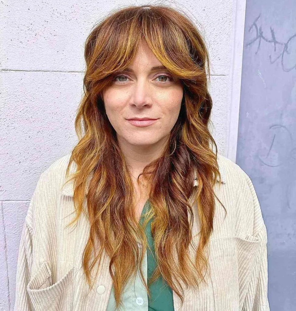 Longer Shaggy Haircut with Face-Framing Bangs for forty year old ladies