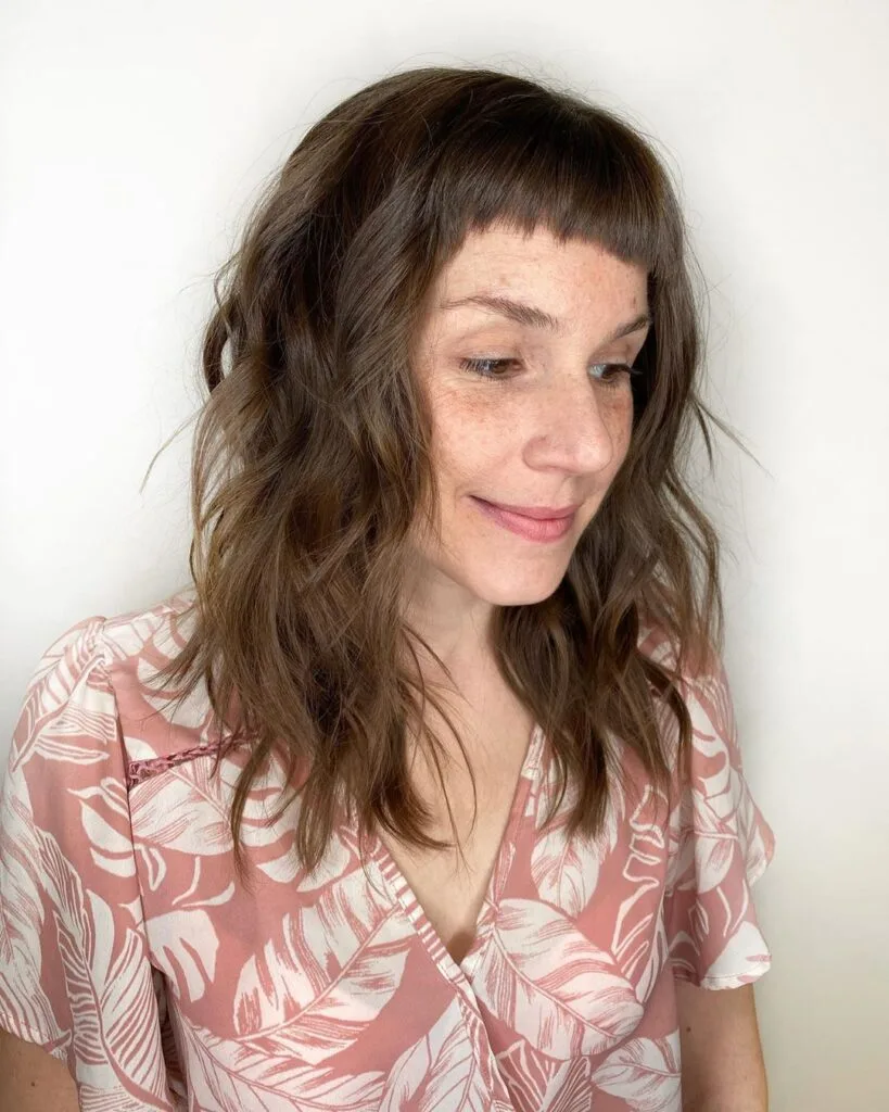 mid-length shag for ladies over 50 with thick hair