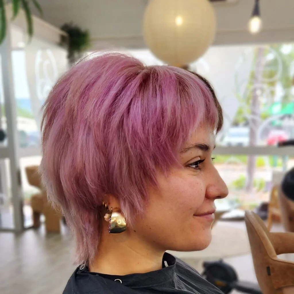 Playful Textured Pixie Cut with Vibrant Lavender Highlights