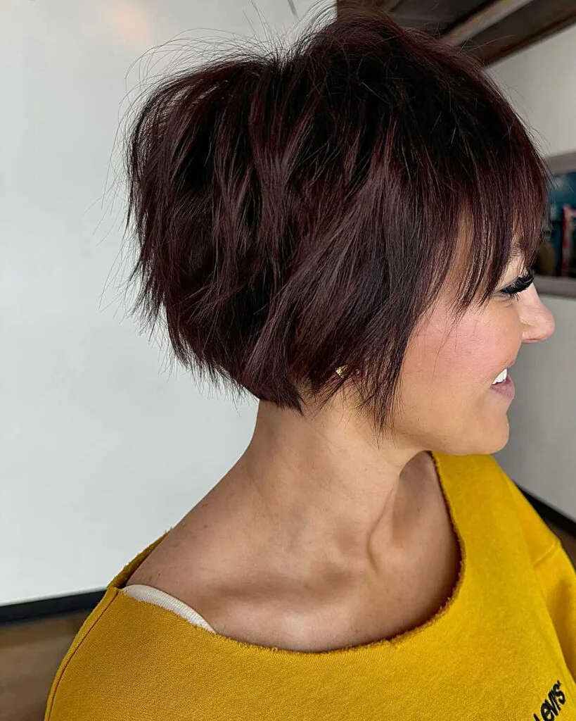 Plum-toned black choppy bixie bob with textured layers