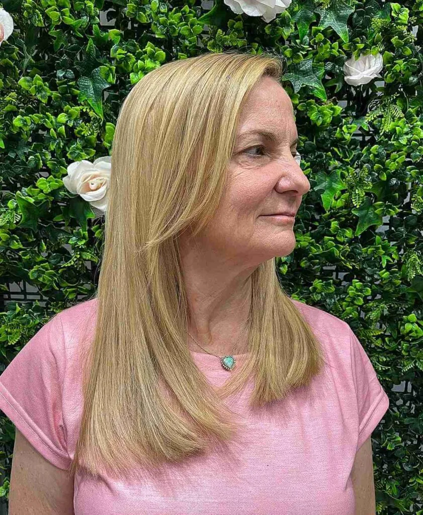 Radiant Honey Blonde on Sleek Hair for an Older Woman