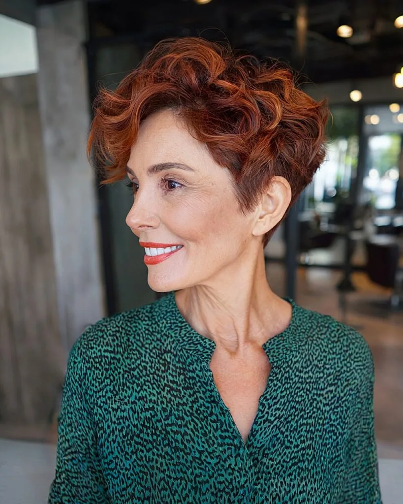 Short wavy pixie cut with tapered sides and red color for women over 50