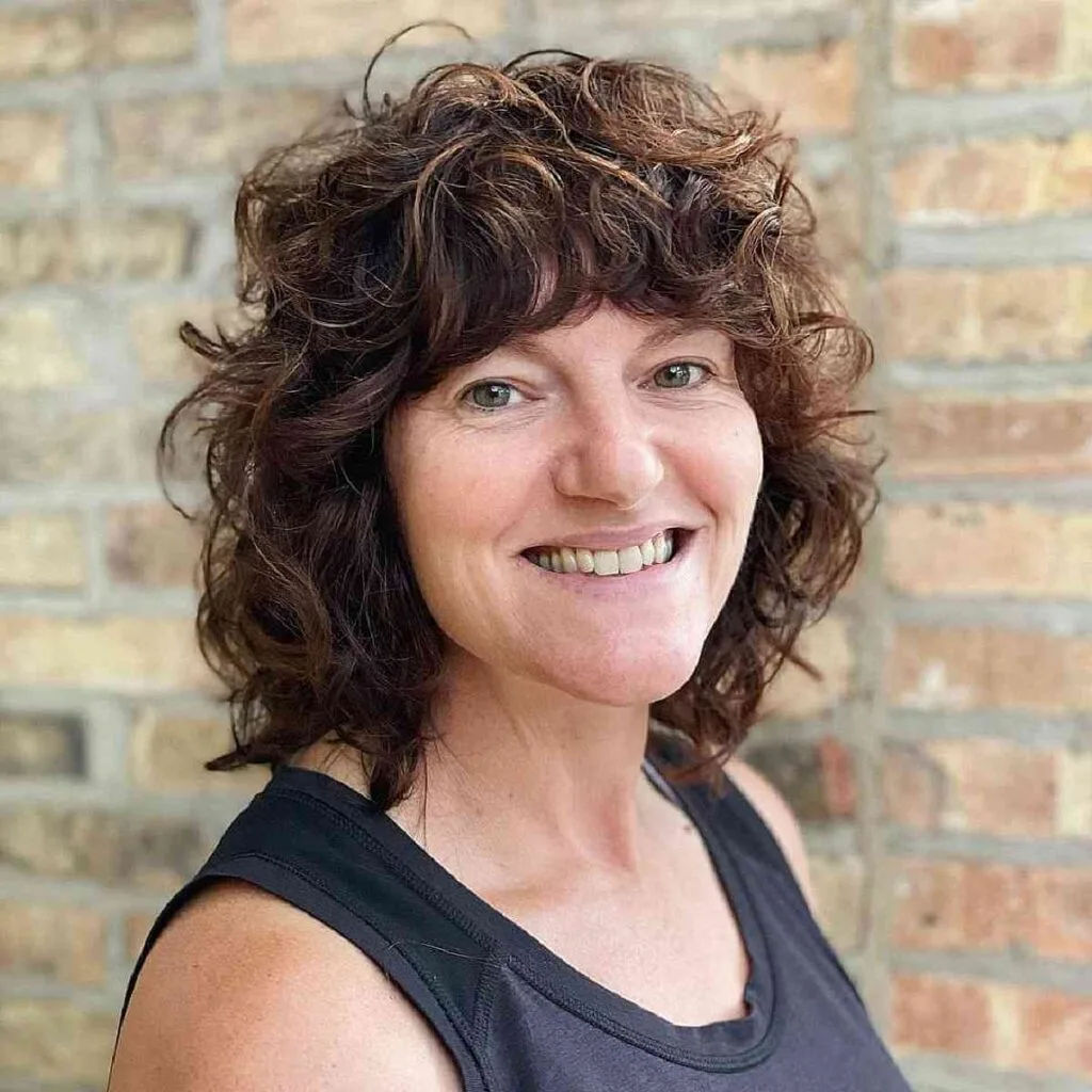 Shoulder-Length Shaggy Bob on Curly Locks