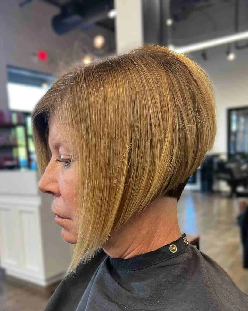 Sleek Stacked Cut Featuring a Warm Blonde Hue for Older Women
