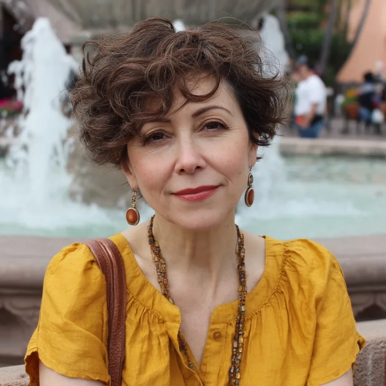 Soft Wavy Curls with Face-Framing Layers for Women Over 50