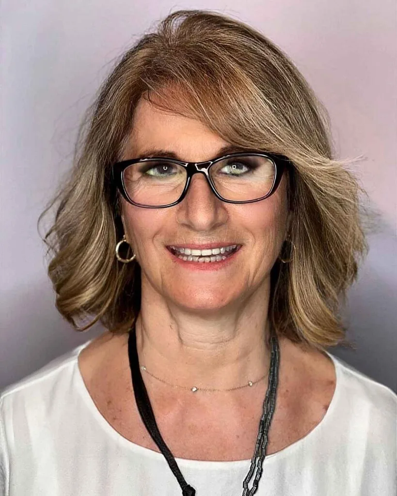 Stylish Mid-Length Haircut for Women with Petite Glasses