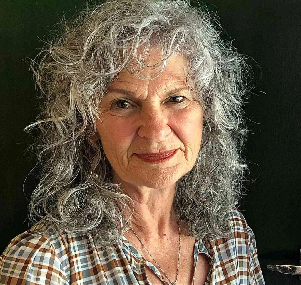 Textured and Lively Curly Shag with bangs for Ladies in their 60s with shoulder-length hair