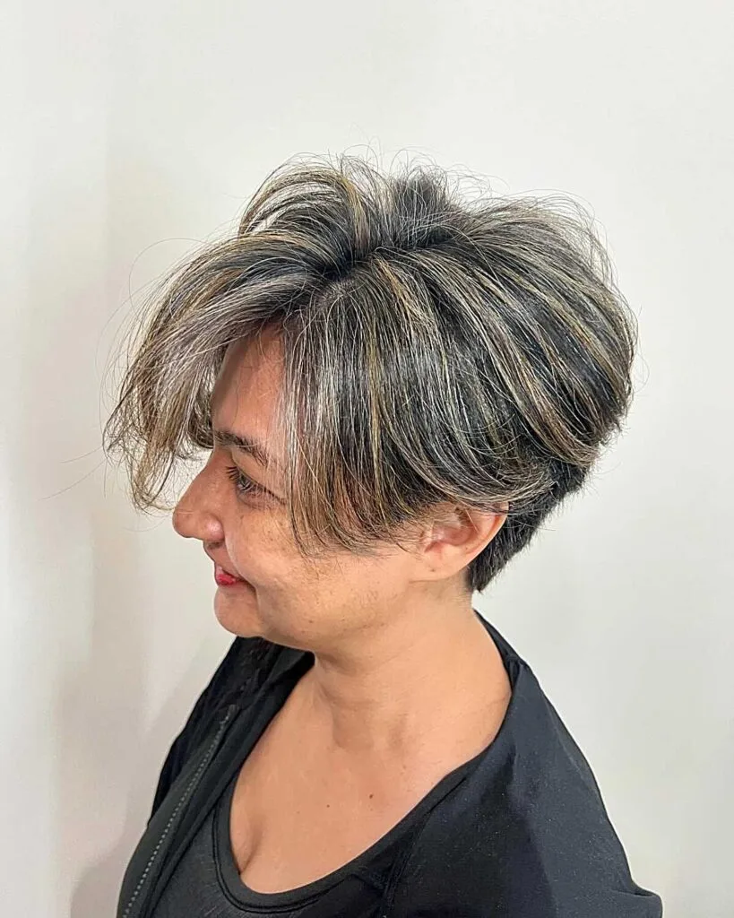 Tousled salt and pepper bixie with dramatic crown lift