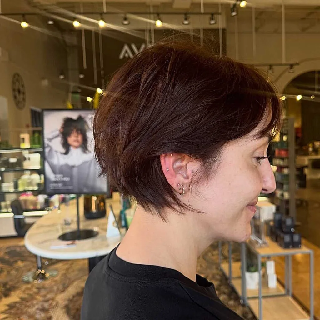 Warm chestnut bixie with choppy layers and ear-length sides