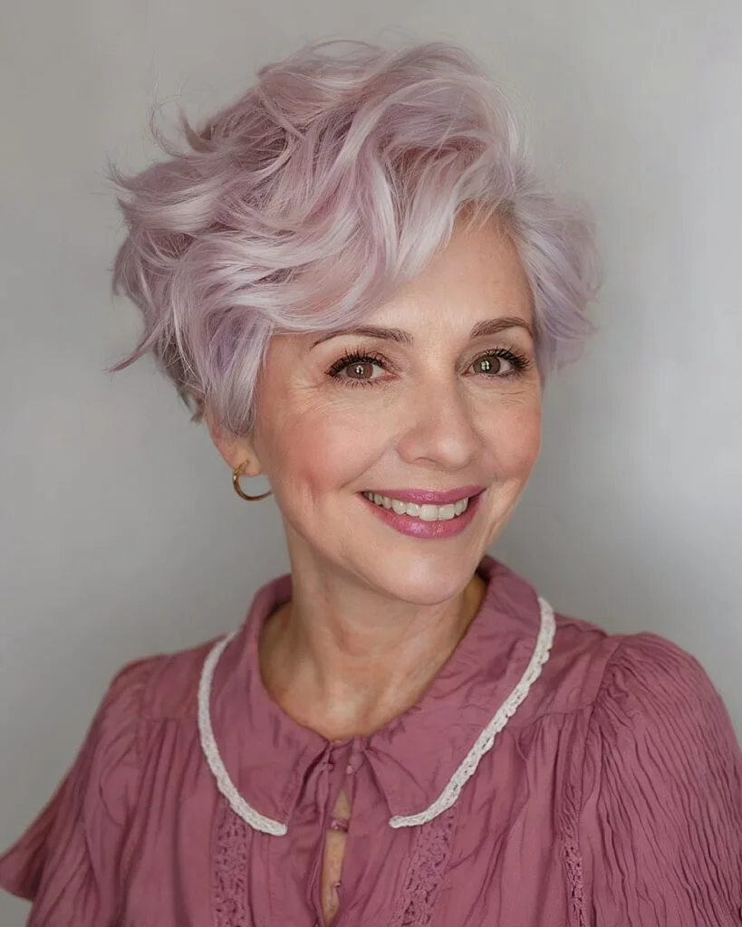 Wavy pixie cut with pastel lavender color and flattering volume for round face