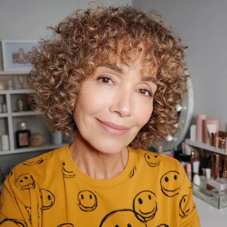 Charming Curly Bob with Brow-Skimming Bangs