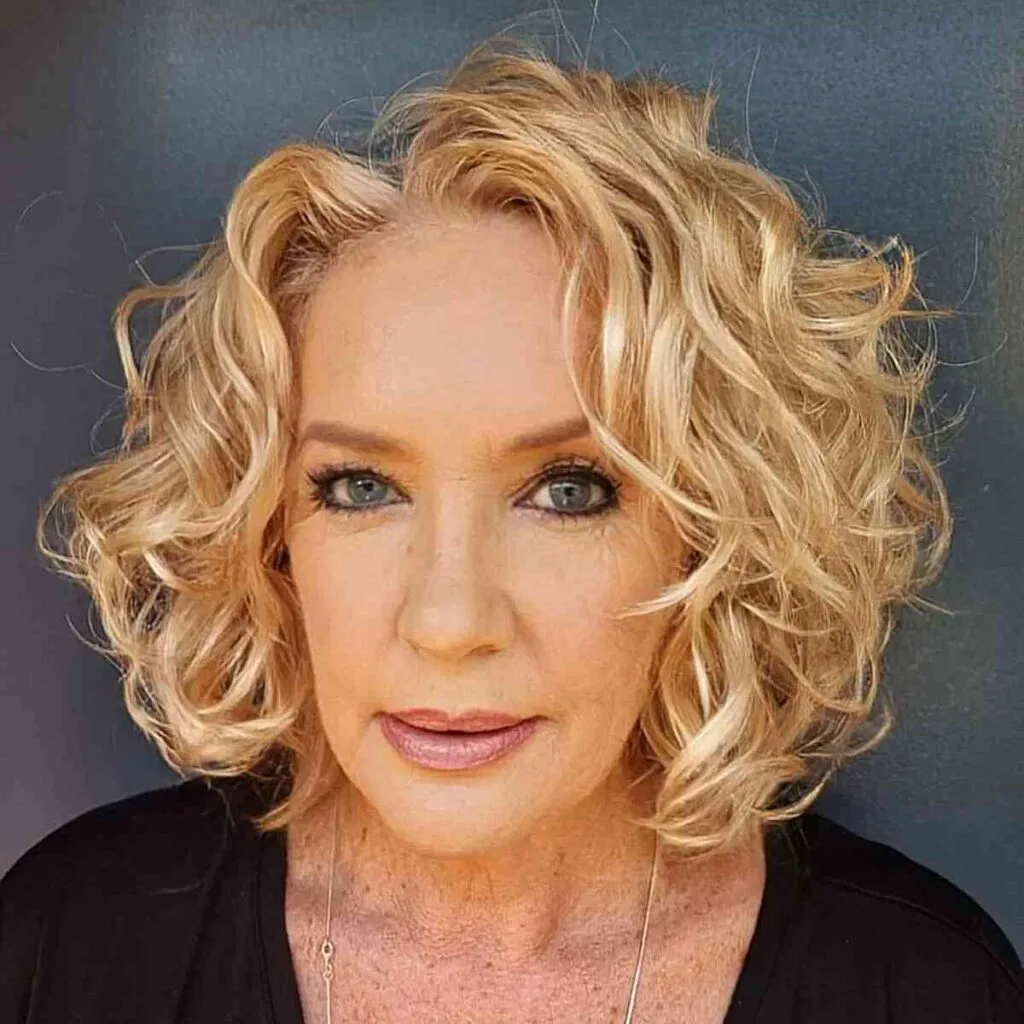 Charming short golden balayage wavy bob for women over 60 and beyond
