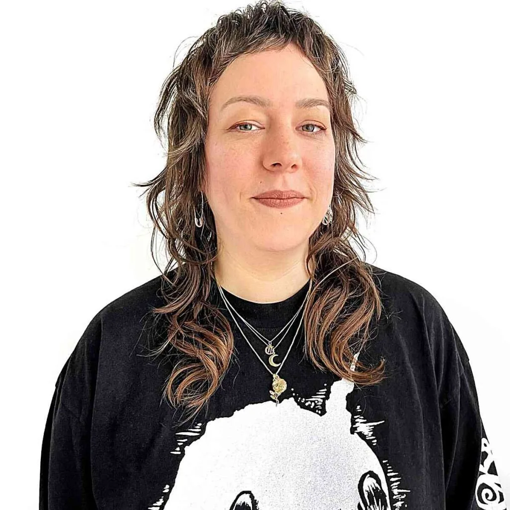 Chest-Length Light Shag with Flicked Layers for 40-Year-Old Ladies with Long Faces