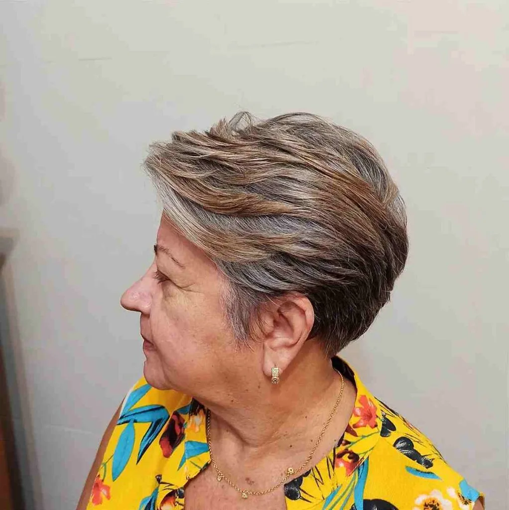 Chic Short Graduated Pixie Haircut with Accent Highlights for a 60-Year-Old