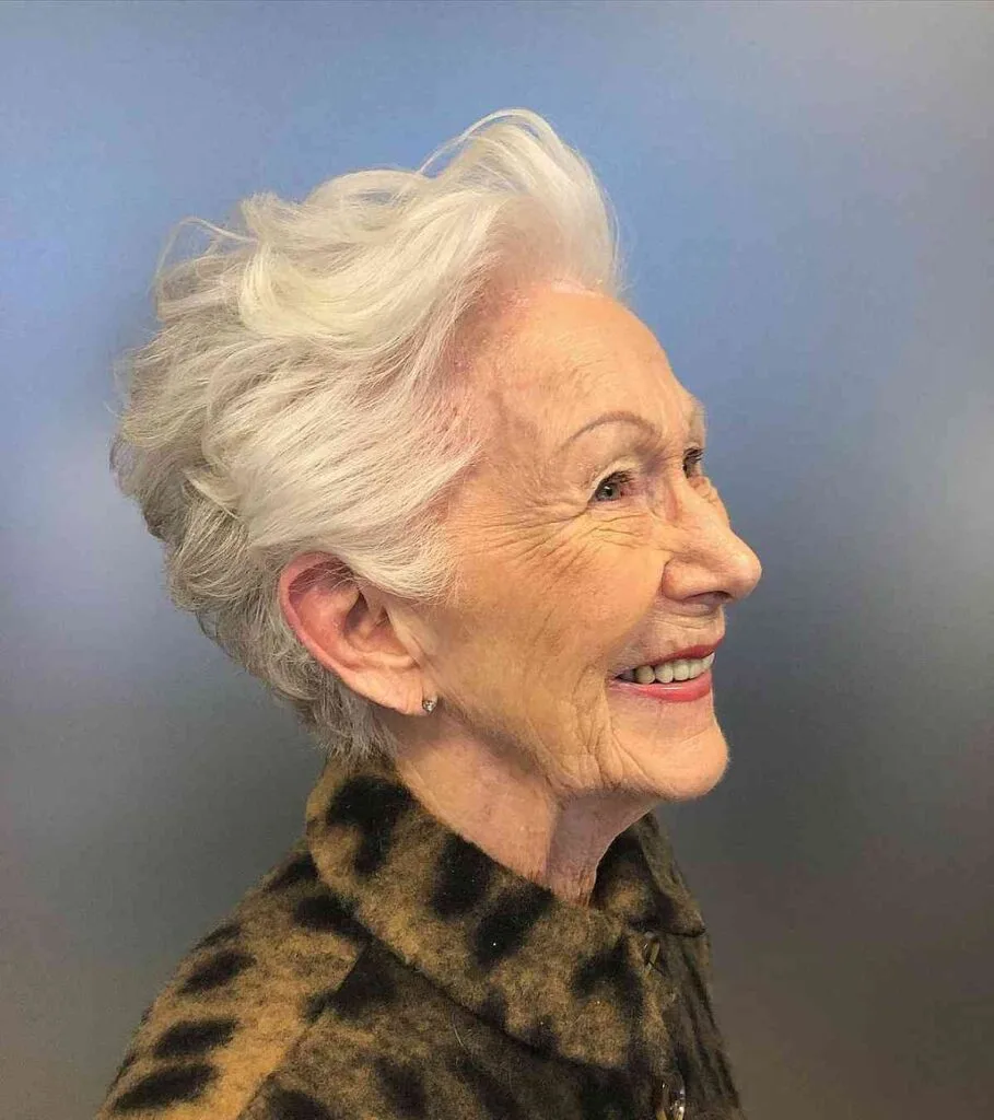 Chic Short Pixie with Platinum Highlights for a Woman in Her 60s