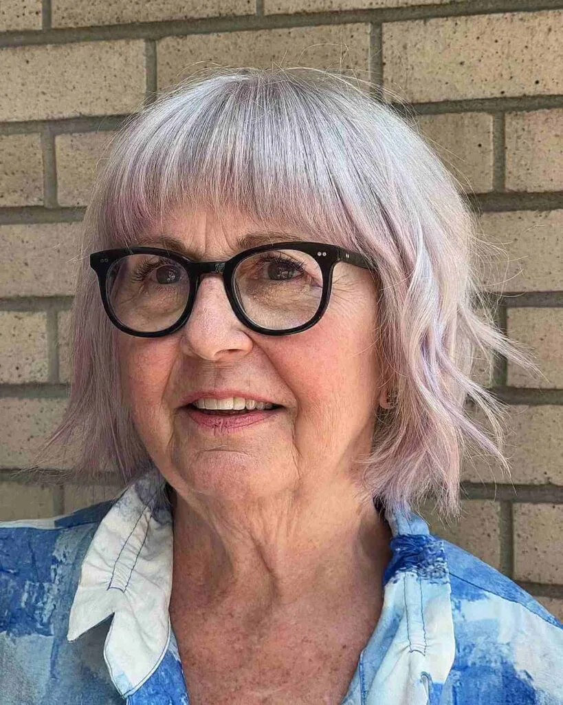 Chic Textured Bob with Short Bangs for a Lady in Her 60s