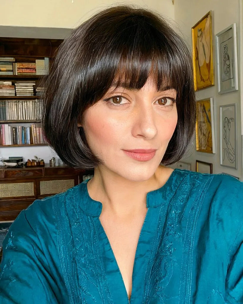 Classic short bob with full bangs for straight thick hair on women over 40
