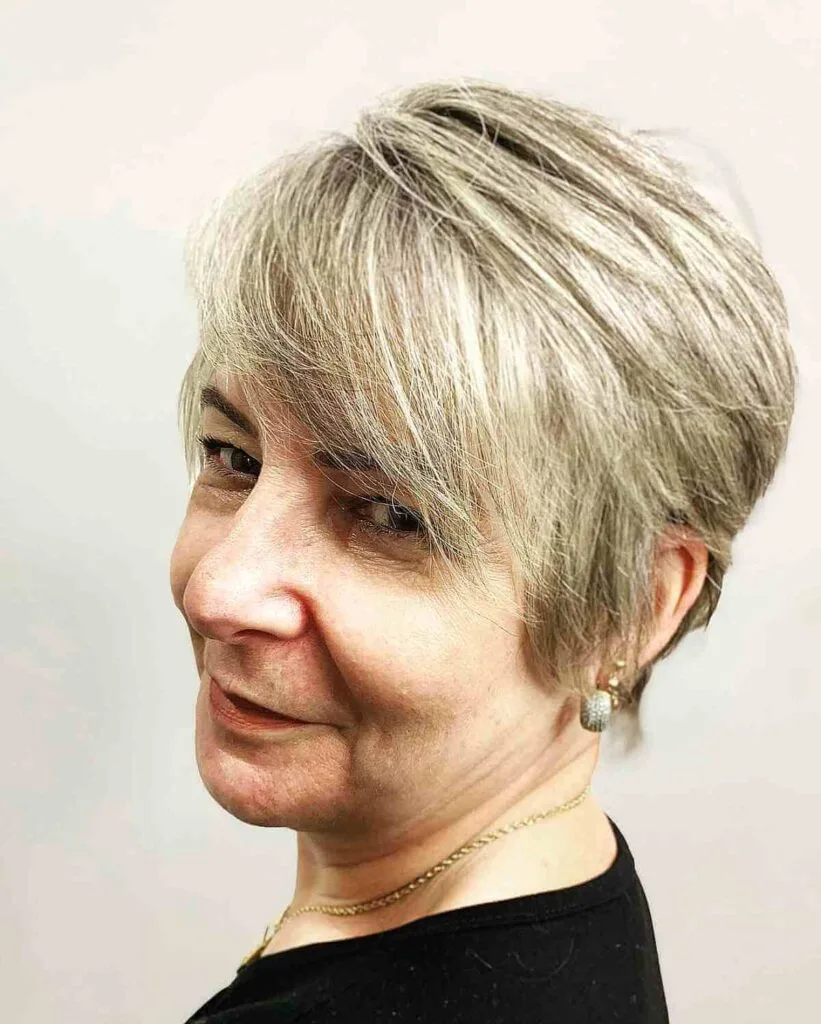 Elegant Long Pixie with Side-Swept Bangs for women over sixty