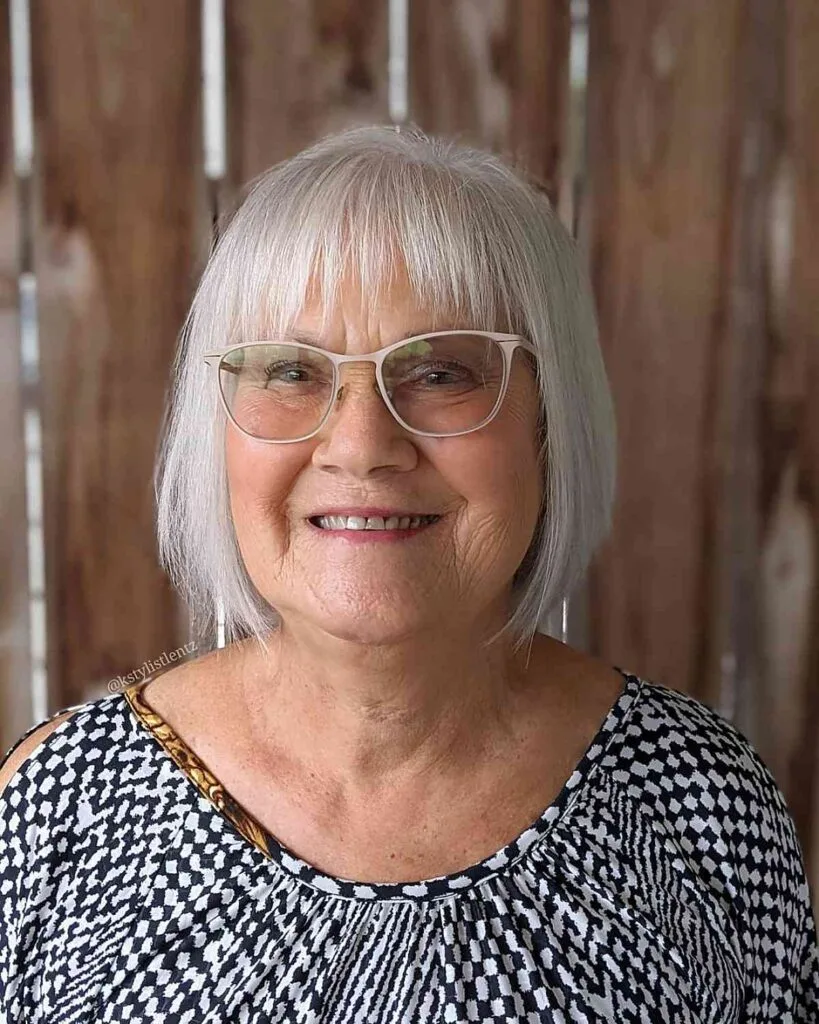 elegant rounded bob for women over 60 with eyewear