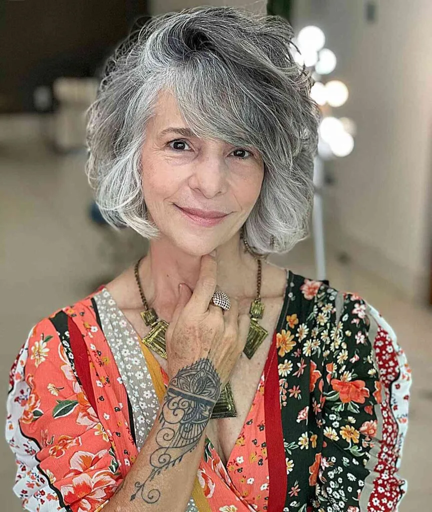 Elegant Short Bob for Women Aged 60 with salt and pepper hair and layers