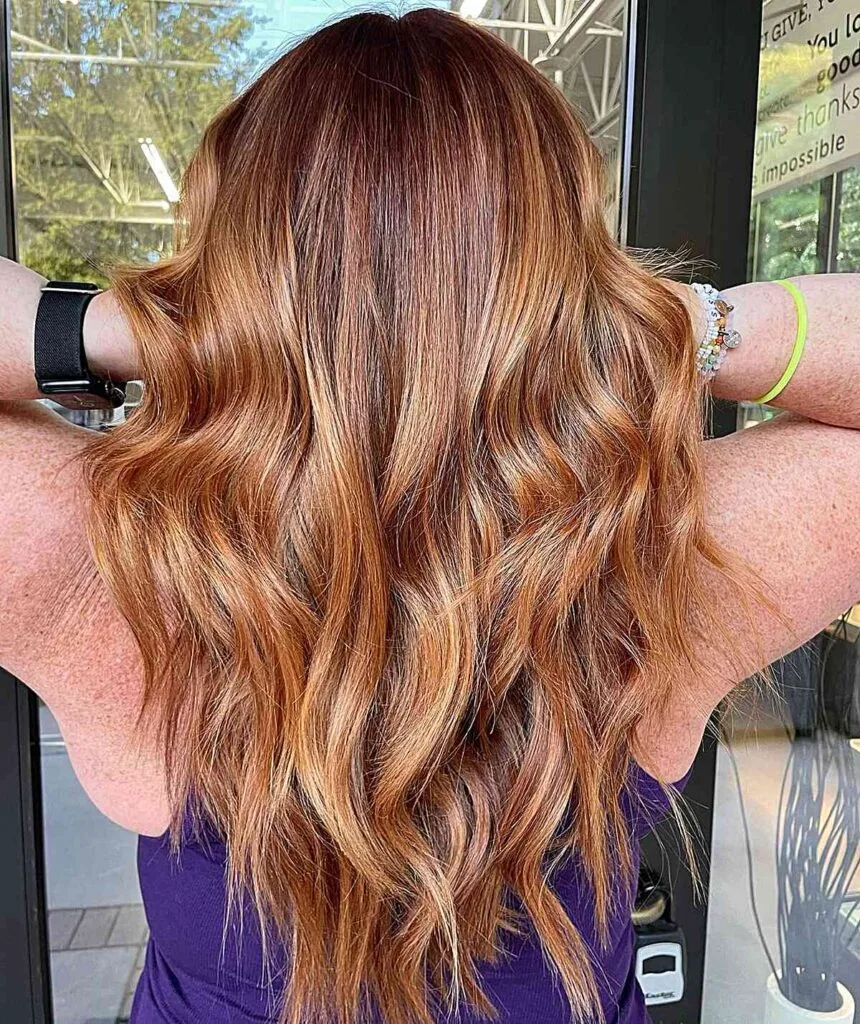 Low-Maintenance Strawberry Blonde Long Hair for Fall and Women Aged 40