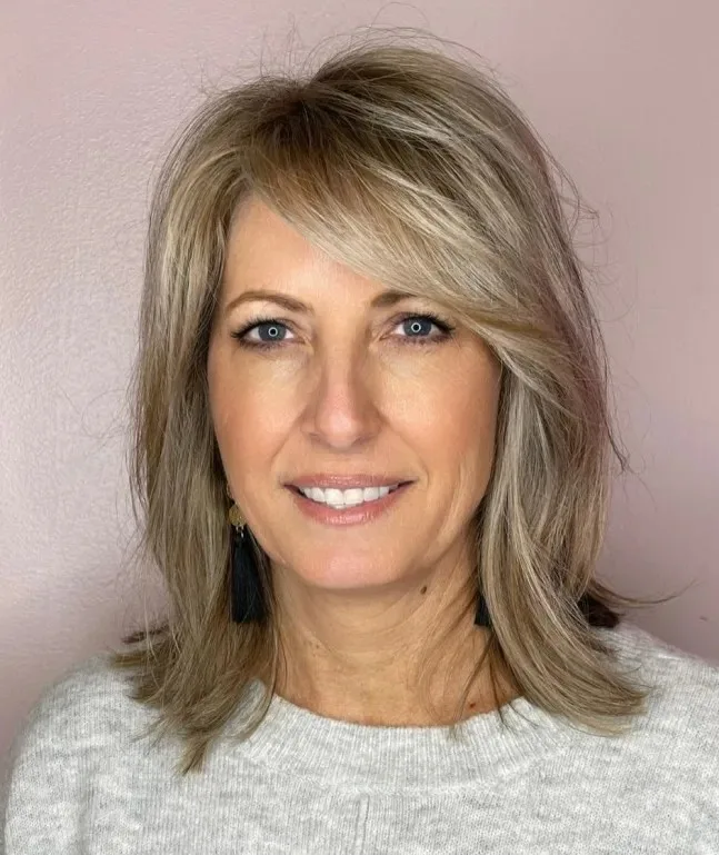 Modern Face-Framing Layers with Soft Bangs