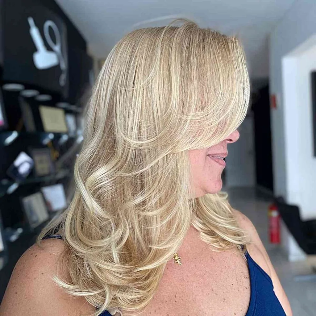 Radiant Blonde on Mid-Length Layered Hairstyle for Plus Size Women Aged 50 and Up