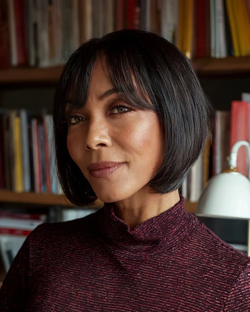 Short bob with curtain bangs for mature women with sleek, straight hair and rounded edges