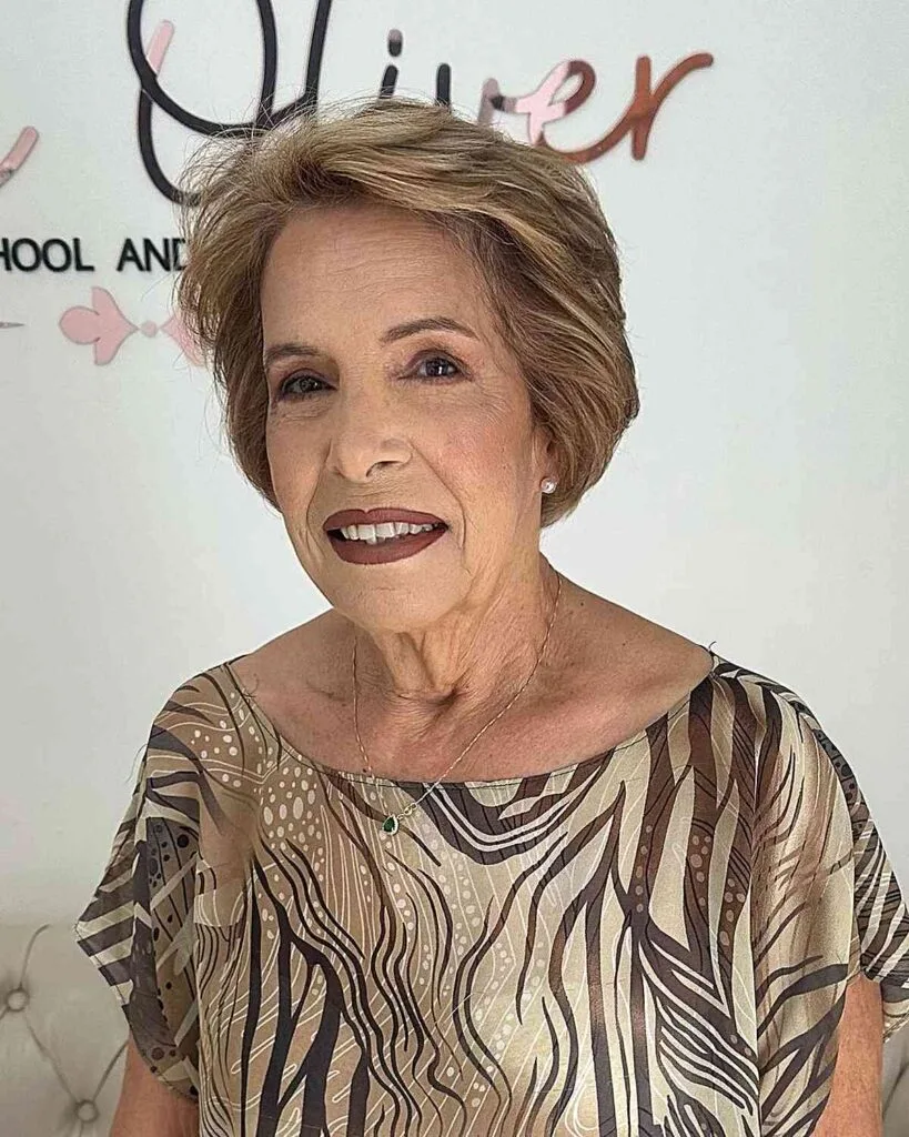Short Hairstyle for Women Aged 60 with Fine Hair Brushed Back