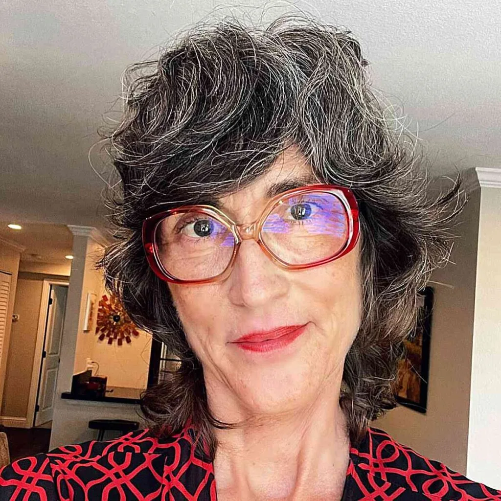 Short Vintage Shullet with Side-Swept Bangs on Older Ladies with Glasses