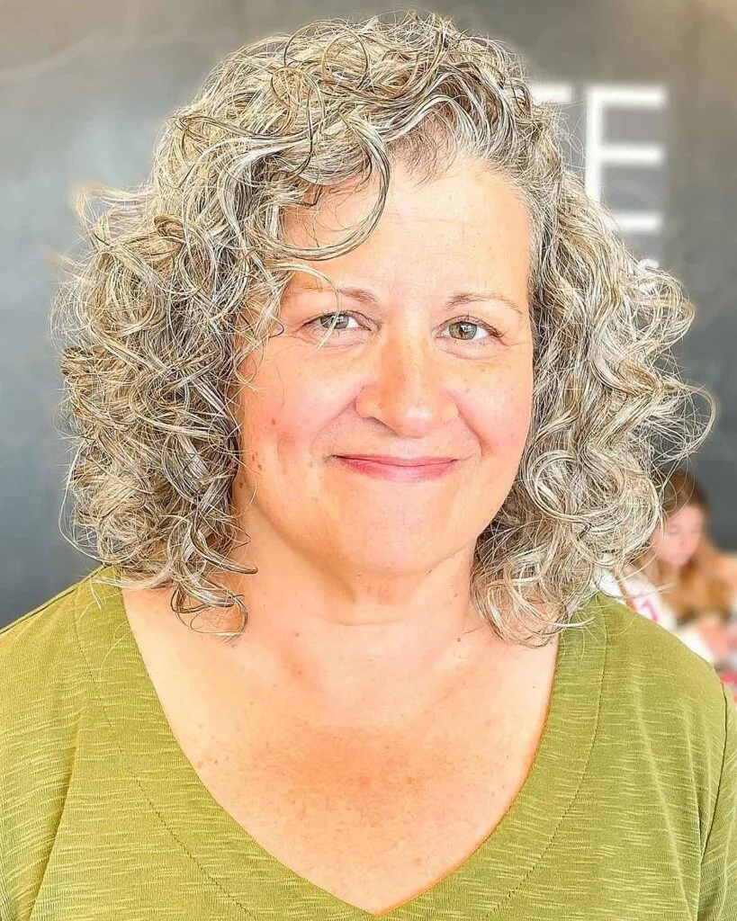 Shoulder-length haircut for women in their 50s with Curly Hair