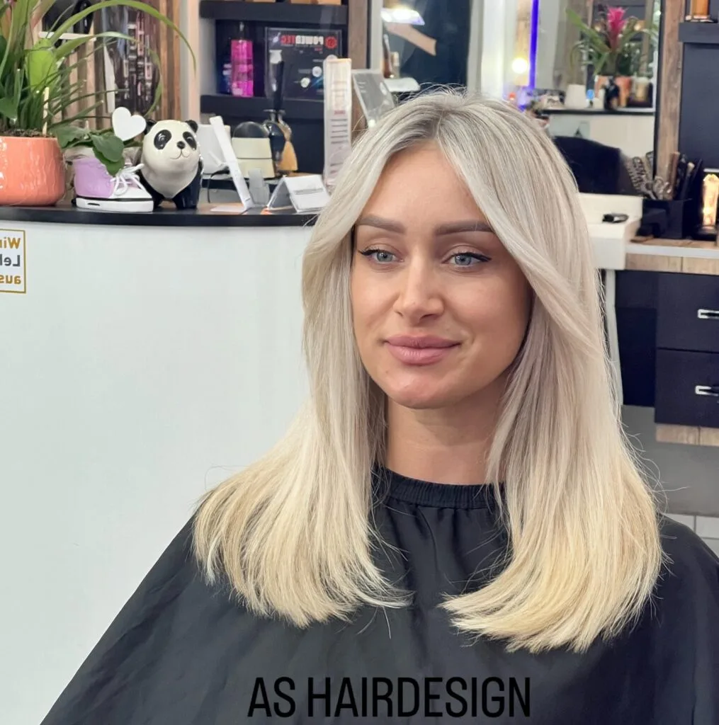 Soft Light Blonde Cut with Subtle Face-Framing Layers