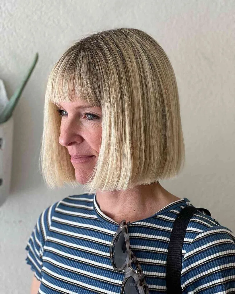 Stylish Long Blunt Bob with Full Bangs for Ladies Over 40