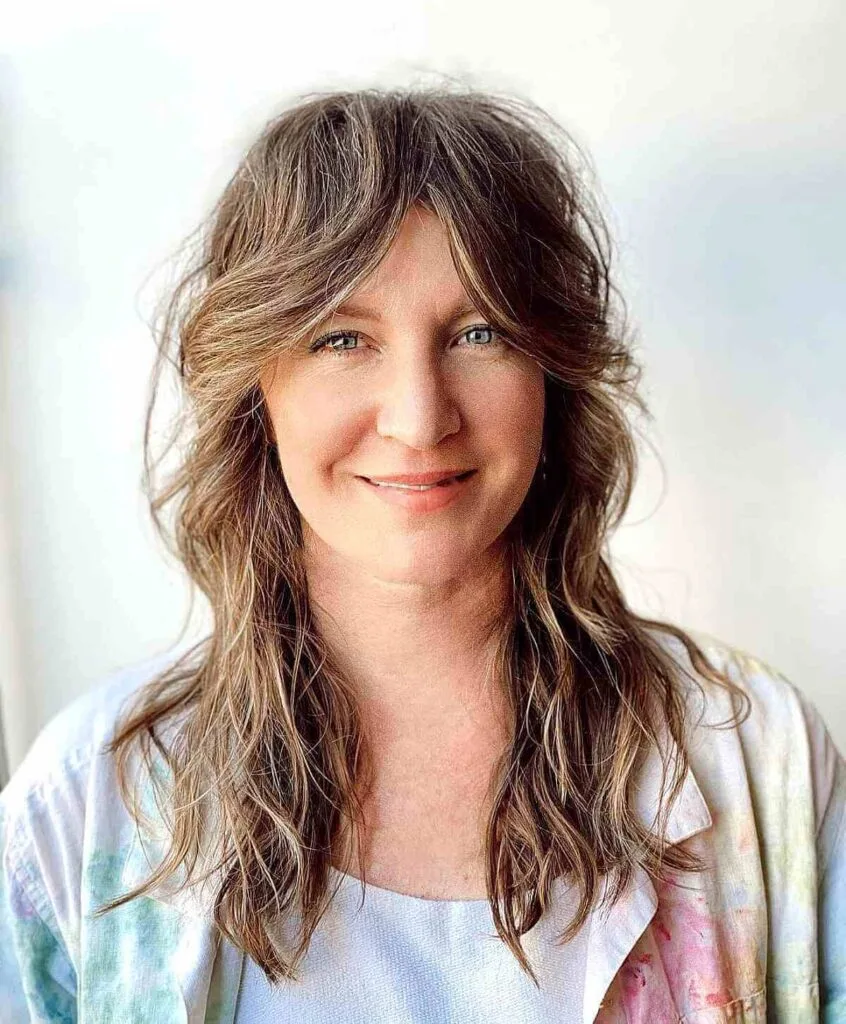 Textured Shag with Extended Curtain Bangs for a 40-Year-Old Lady