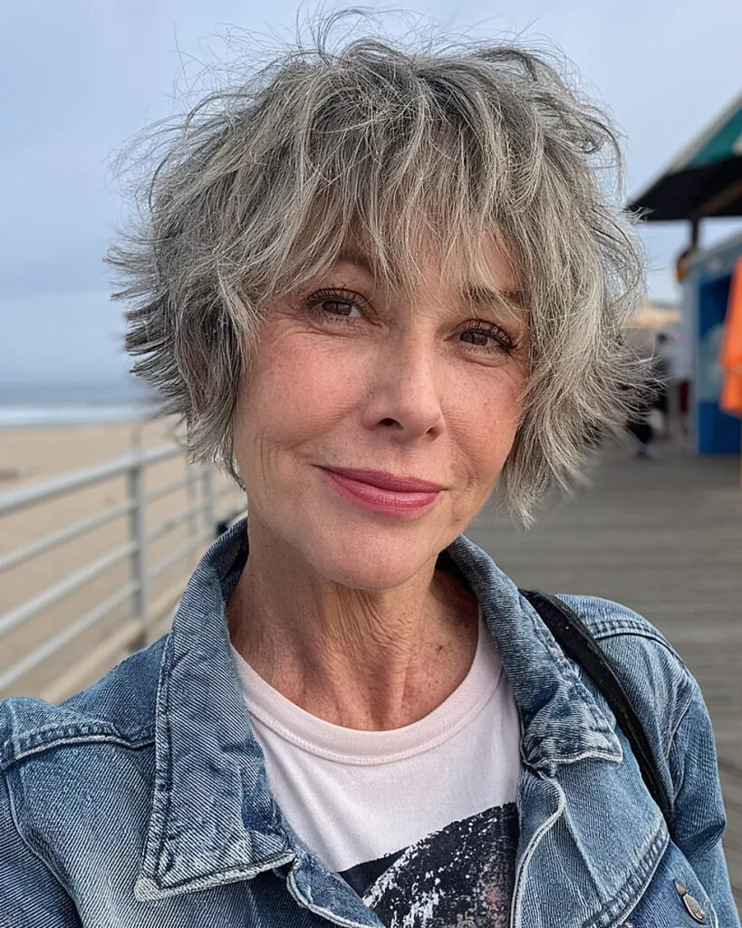 Tousled short shag with natural grey highlights for mature women