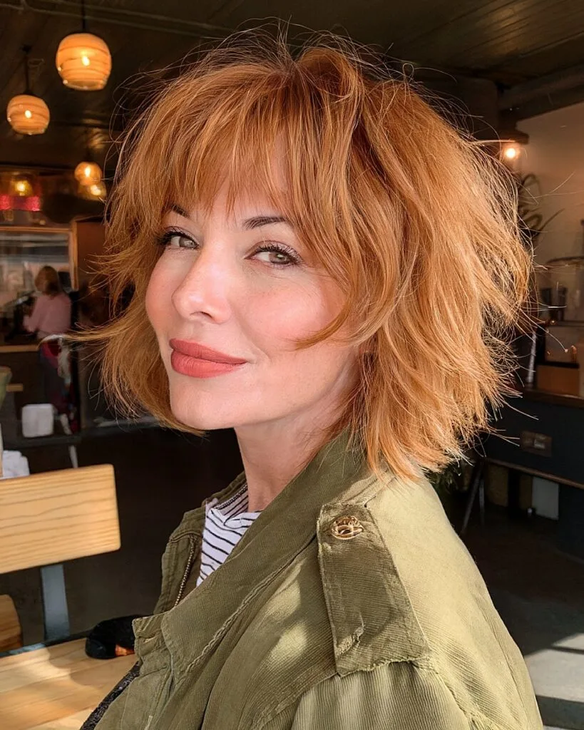 Volumizing shaggy bob with bangs for women over 40 with thick, textured hair