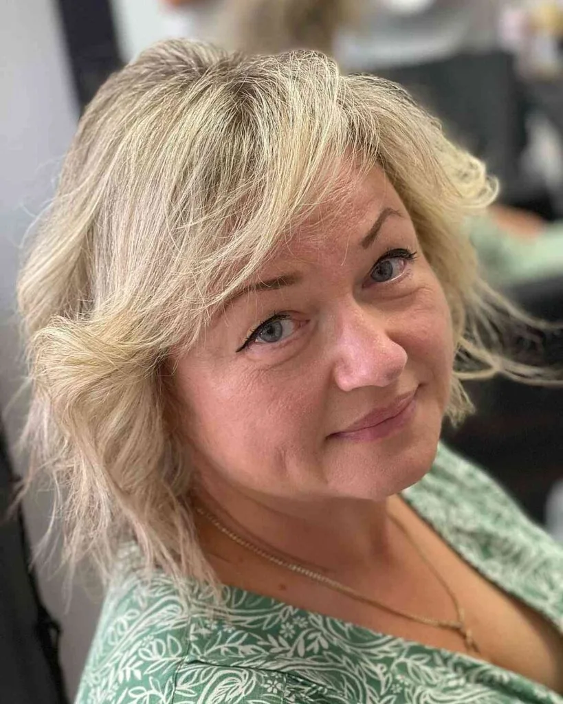 Blonde Feathered Bob with Side-Swept Bangs for Old Women with Fine Hair