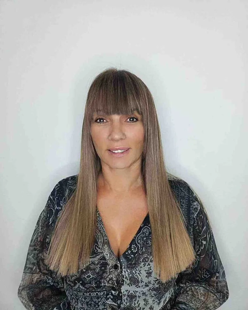 Chest-Length Blunt Haircut with Sleek Fringe for women in their 50s