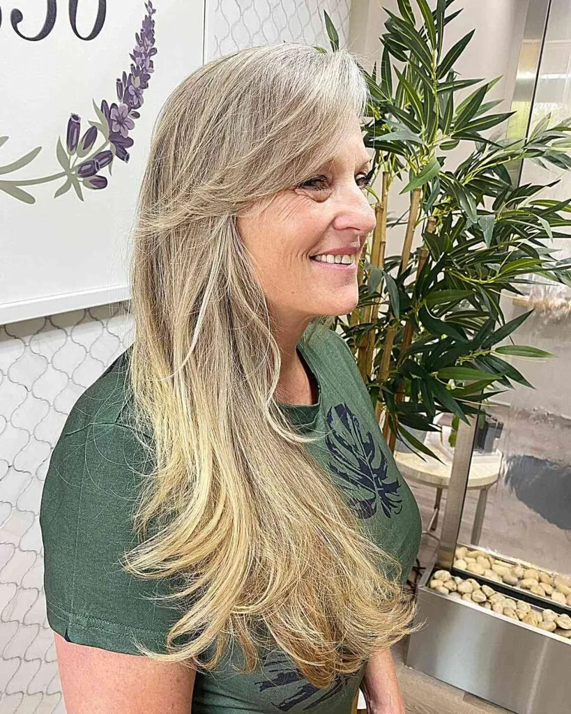 Chest-Length Haircut with Layered Bangs for Older Women