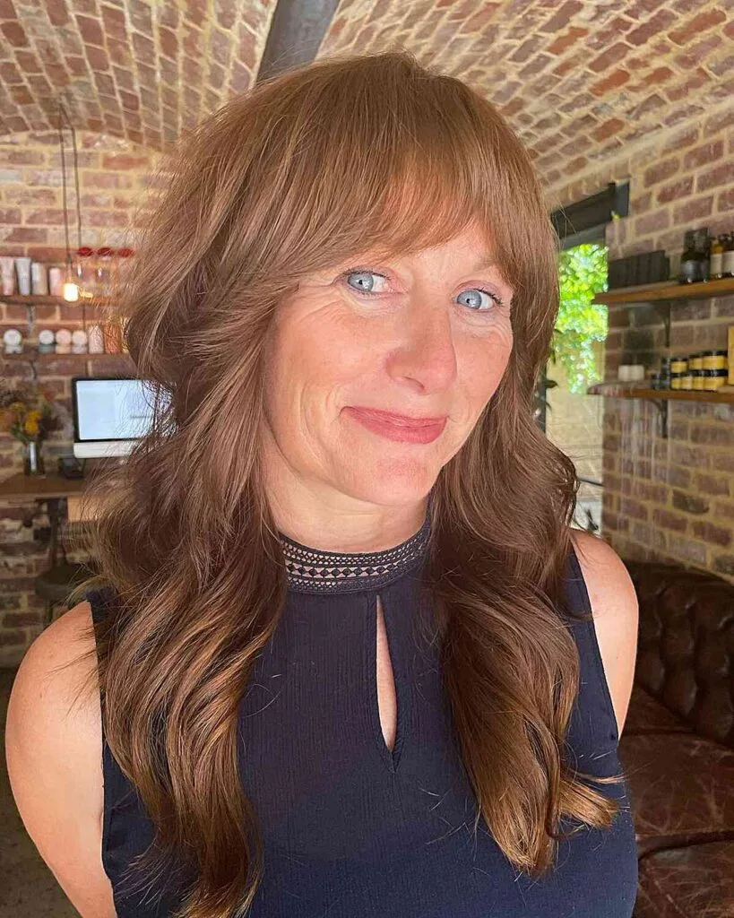 Chest-Length Wavy Wolf Shag with Soft Bangs for Mature Ladies Aged 50