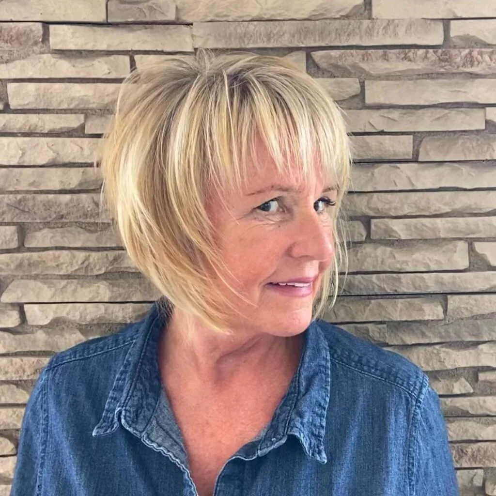 Chic blonde bob with bangs for chin-length thick haired women over 50