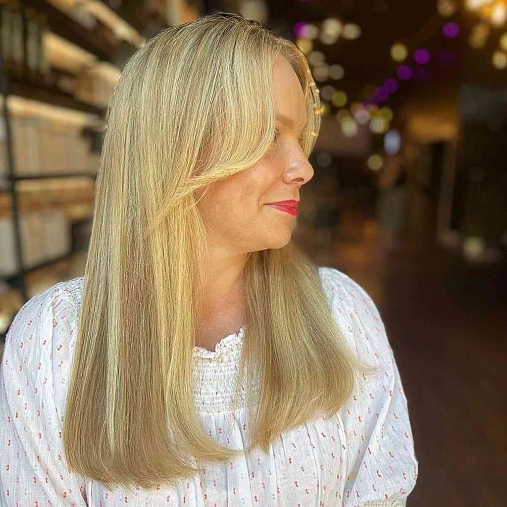 Face-Framing Bangs on Straight Blonde Long Hair on Women of Age 50