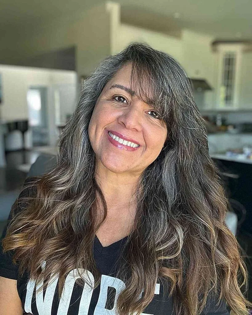 Lengthy Side-Swept Wavy Hair with Fringe for ladies passed their 50s