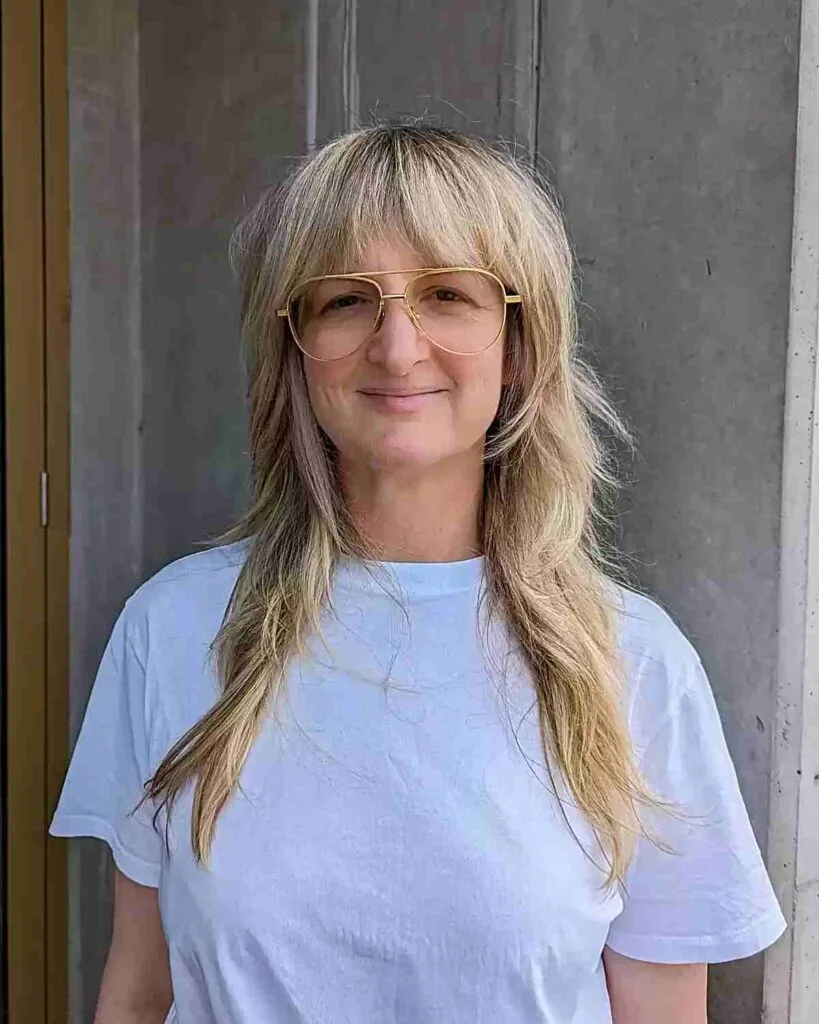 Long '70s Shaggy Blonde Hair with Fringe on Ladies Aged 50 and Up