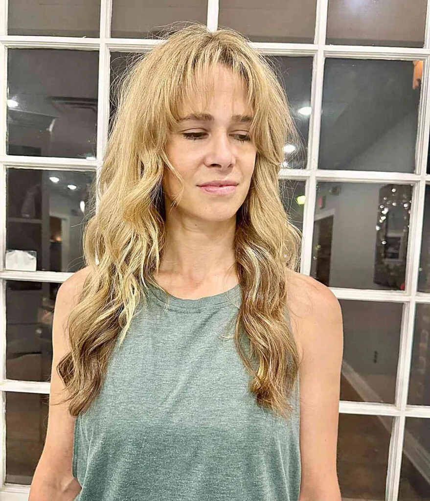 Long Blonde Waves and Barely-There Bangs for Women Over 50