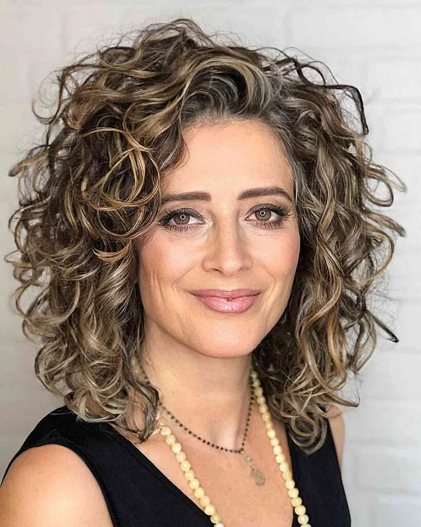 Medium Beautiful Natural Curls with Luminous Highlights for Women Aged 40