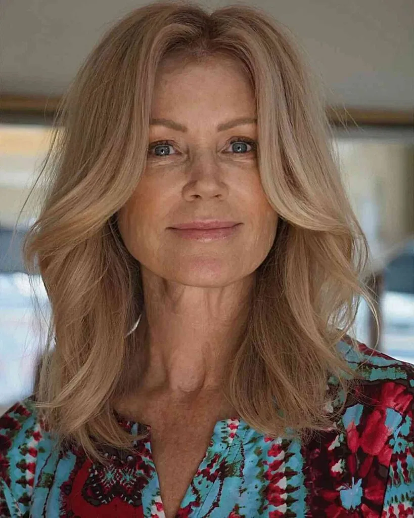 Medium-Length Cut with Added Volume for Women Aged 40 and Over with a middle part