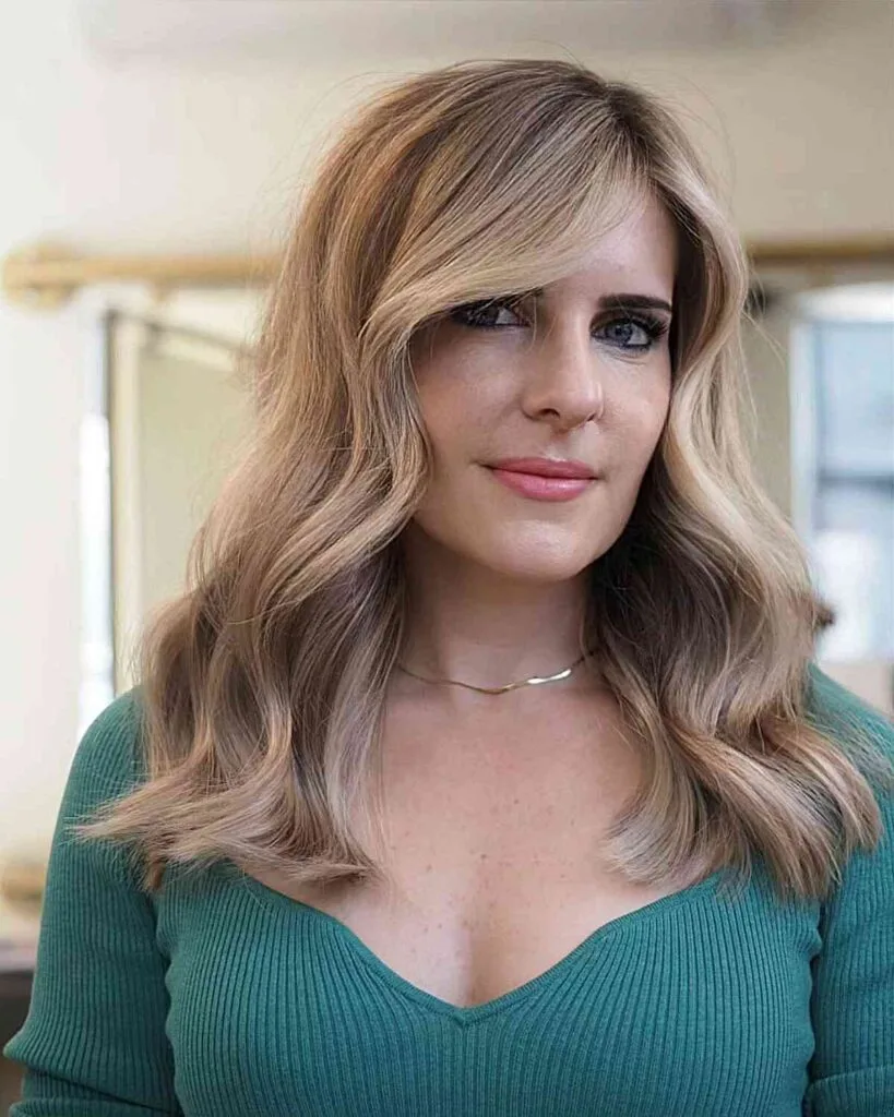 Mid-Length Classic Dirty Blonde Balayage with a Side Part for Women Aged 40